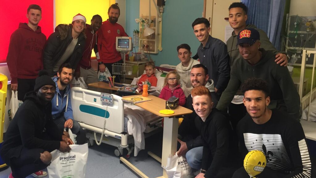 SQUAD DELIVER GIFTS TO HOSPITAL PATIENTS